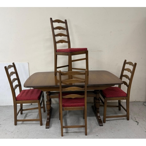 142 - An extendable dark Ercol dining table and four slat back chairs with red upholstered seats H73cm W15... 