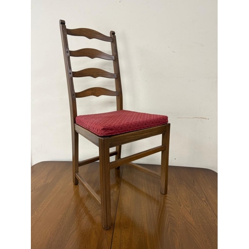 142 - An extendable dark Ercol dining table and four slat back chairs with red upholstered seats H73cm W15... 