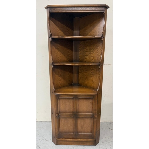 148 - A dark Ercol free-standing corner cabinet with three shelves over a single door cupboard H184cm W72c... 
