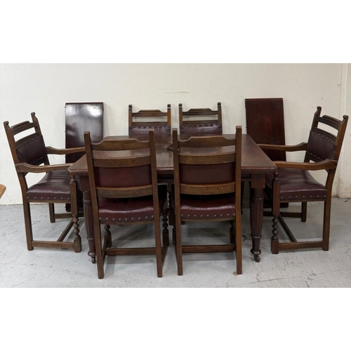 150 - A mahogany extendable dining table on turned legs and a set of six oak framed dining chairs with red... 
