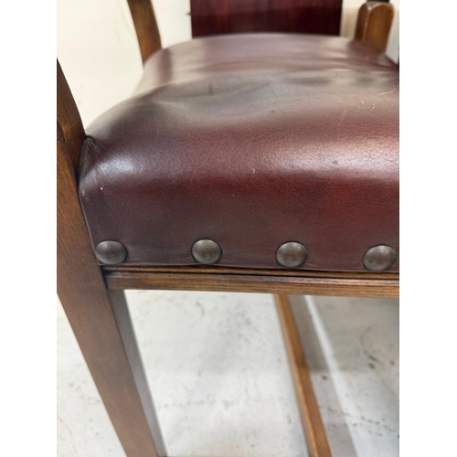150 - A mahogany extendable dining table on turned legs and a set of six oak framed dining chairs with red... 
