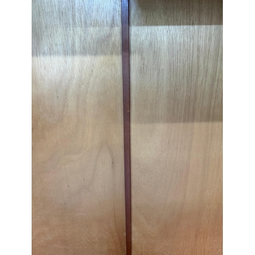 153 - A Stag two-door dark wood wardrobe with two internal cross rails and a single shelf H178cm W1126cm D... 