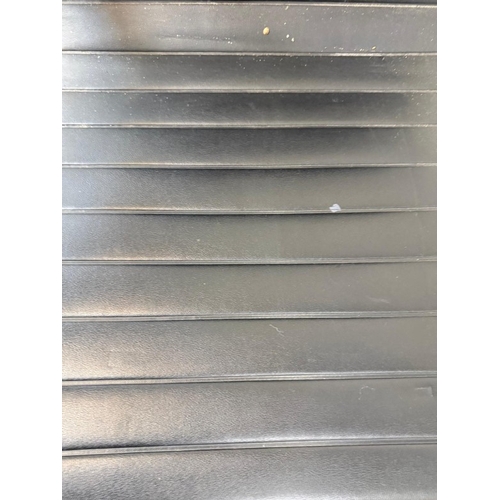 155 - A chrome and black faux leather office chair in the manner of Herman Miller Eames