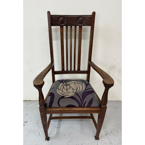 156 - An oak Arts and Crafts style open armchair with floral upholstery