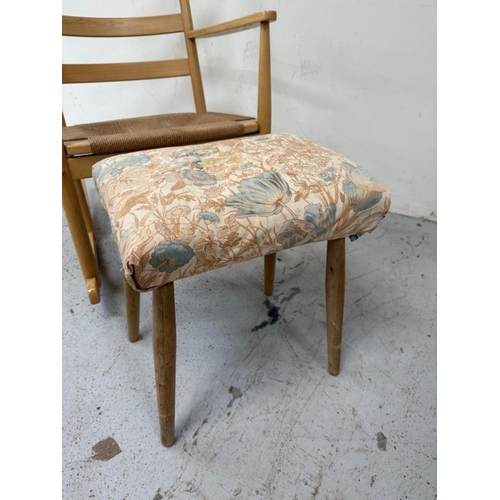 158 - A teak slat back rush seated rocking chair and footstool