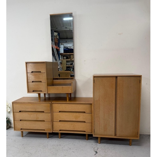 161 - A Mid Century bedroom suite by Stag comprising of a wardrobe, two chest of drawers and a dressing ta... 