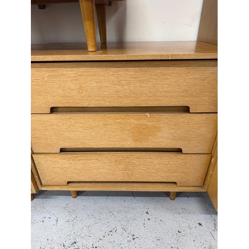 161 - A Mid Century bedroom suite by Stag comprising of a wardrobe, two chest of drawers and a dressing ta... 