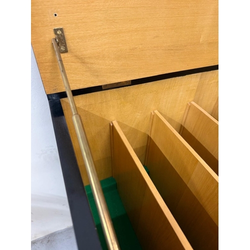 163 - A Mid Century ebonised record cabinet with hinged lid opening to storage and a single door cupboard ... 