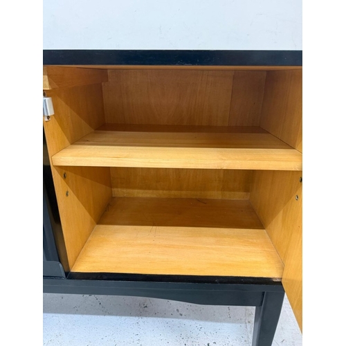 163 - A Mid Century ebonised record cabinet with hinged lid opening to storage and a single door cupboard ... 