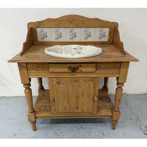 166 - A vintage pine wash stand with floral tiled back splash and sink with drawer and cupboard under H106... 
