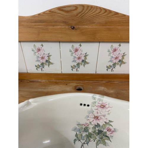 166 - A vintage pine wash stand with floral tiled back splash and sink with drawer and cupboard under H106... 