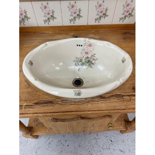 166 - A vintage pine wash stand with floral tiled back splash and sink with drawer and cupboard under H106... 