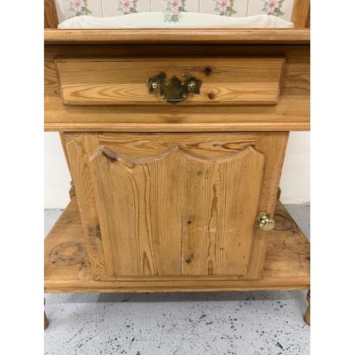 166 - A vintage pine wash stand with floral tiled back splash and sink with drawer and cupboard under H106... 