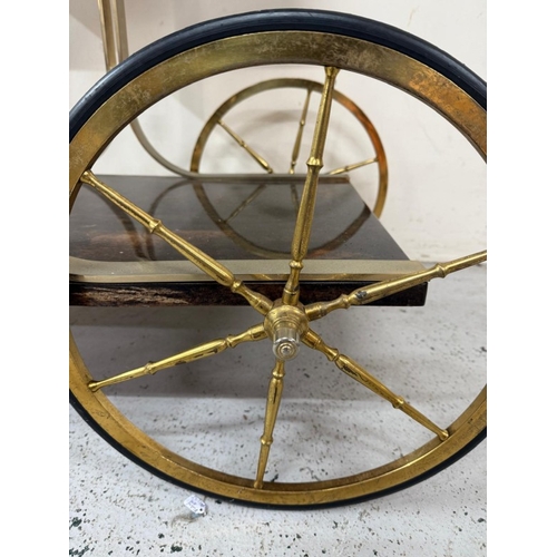 168 - An Aldo Tura Goatskin brass loop bar trolly on cart wheel effect castors and wheels H80cm W78cm D47c... 