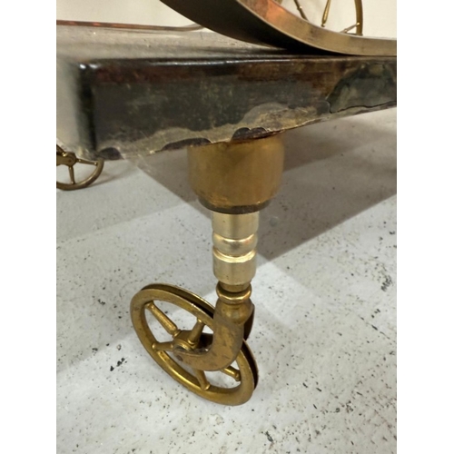 168 - An Aldo Tura Goatskin brass loop bar trolly on cart wheel effect castors and wheels H80cm W78cm D47c... 