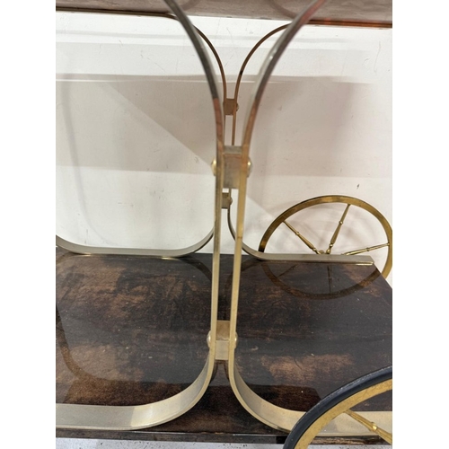 168 - An Aldo Tura Goatskin brass loop bar trolly on cart wheel effect castors and wheels H80cm W78cm D47c... 