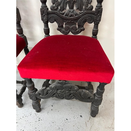 169 - A pair of Neo Renaissance style carved oak hall chairs
