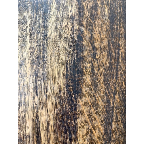 170 - A Belgian oak heavily carved writing table in the Henry II style with drawers flanked by lion head a... 