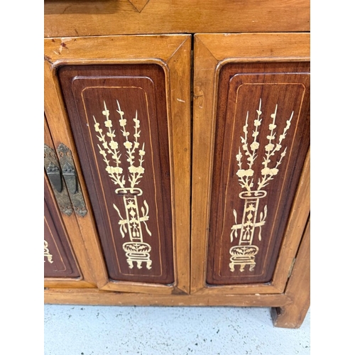 173 - A Chinese sideboard or server with bone inlay, comprising of three short drawers over two door cupbo... 