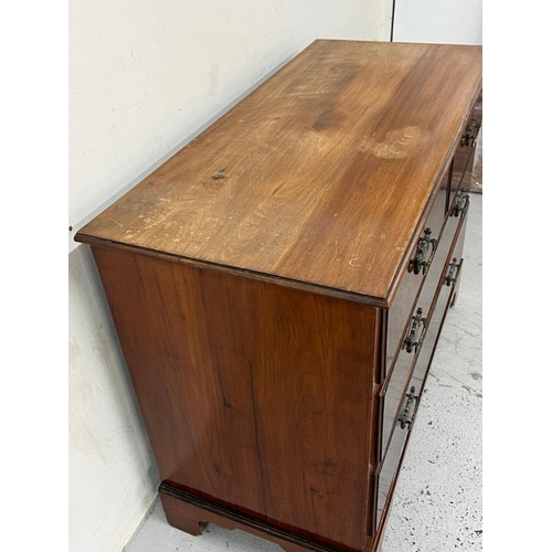 35 - Two over two chest of drawers with burr walnut veneer to front on bracket feet H79cm W107cm D49cm