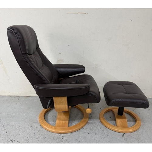 43 - A brown leather stressless reclining armchair and matching footstool