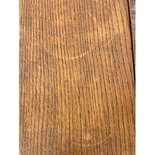 48 - A Regency style oak fire screen with a glazed panel embroidered with a naval scene and a folding top... 