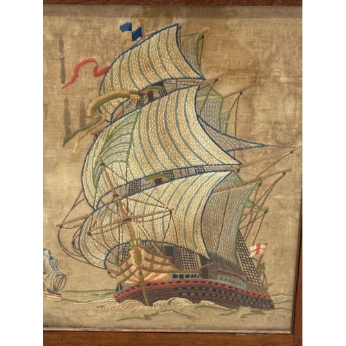 48 - A Regency style oak fire screen with a glazed panel embroidered with a naval scene and a folding top... 