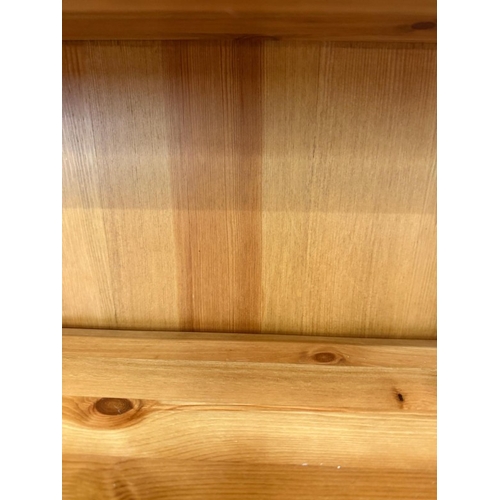 55 - A pine three-shelf waterfall bookcase H99cm W96cm D23cm