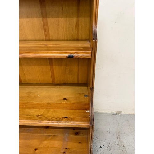 55 - A pine three-shelf waterfall bookcase H99cm W96cm D23cm