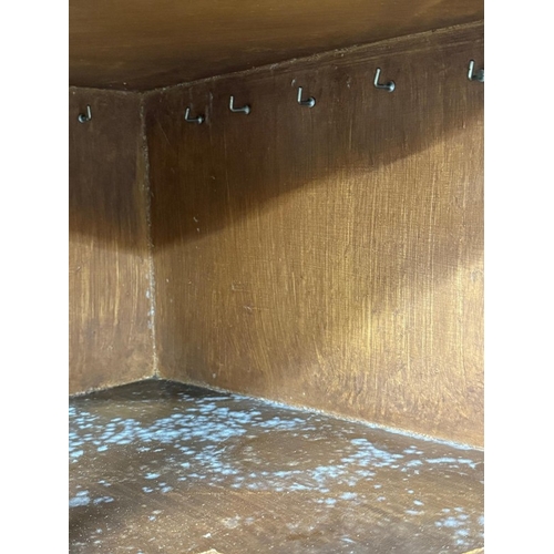 58 - A mahogany free-standing corner cupboard comprising a two-door cupboard with two door astragal glaze... 