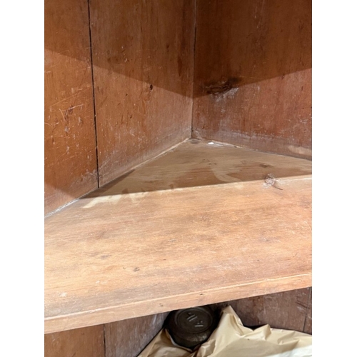 58 - A mahogany free-standing corner cupboard comprising a two-door cupboard with two door astragal glaze... 