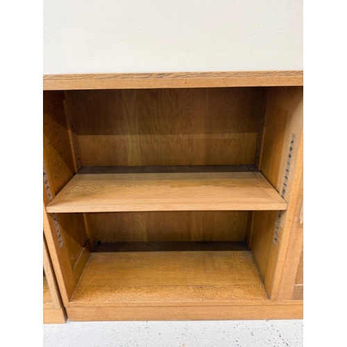 60 - A Mid Century oak modular unit comprising of three cabinets two with cupboards H77cm W100cm D30cm an... 