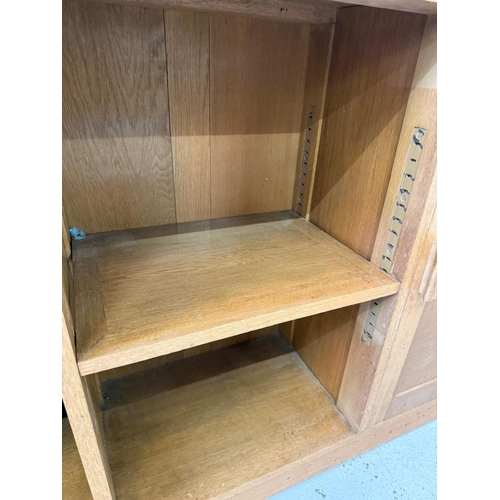 60 - A Mid Century oak modular unit comprising of three cabinets two with cupboards H77cm W100cm D30cm an... 