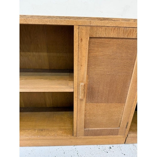 60 - A Mid Century oak modular unit comprising of three cabinets two with cupboards H77cm W100cm D30cm an... 