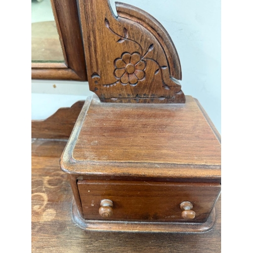 181 - A mahogany demi lune Duchess dressing table with a swing mirror flanked by trinket drawers H140cm W9... 