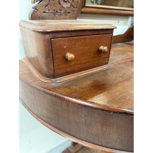 181 - A mahogany demi lune Duchess dressing table with a swing mirror flanked by trinket drawers H140cm W9... 