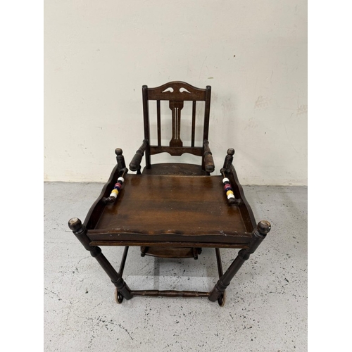 184 - An Edwardian oak metamorphic child's high chair converting to a play chair