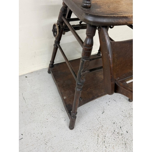 184 - An Edwardian oak metamorphic child's high chair converting to a play chair