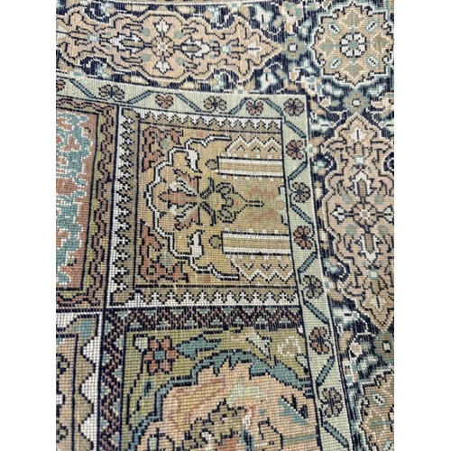 190 - A wool rug with beige ground and a geometric border 160cm x 93cm