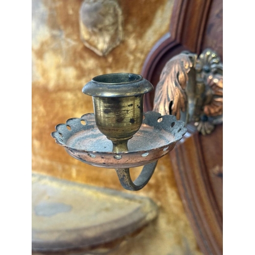 198 - A circular bevel-edged overmantel mirror, the surrounding frame upholstered in mustard yellow velvet... 