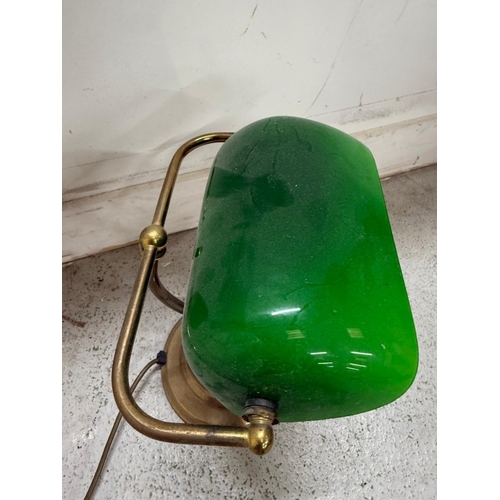 208 - A brass bankers lamp with green glass shade Height 35cm.