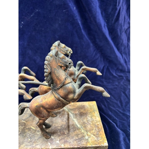 240 - A bronze sculpture featuring a Roman warrior in a four-horse chariot mounted on a marble plinth