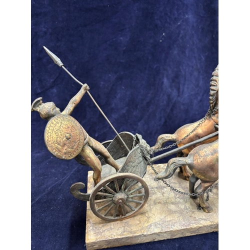 240 - A bronze sculpture featuring a Roman warrior in a four-horse chariot mounted on a marble plinth