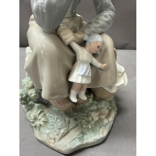 257 - Lladro porcelain figure 'Girl with Doll' model number 1211 by Antonio Ballester, retired 1994.
