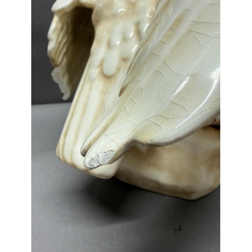 259 - A large Royal Dux eagle, circa 1920 with some damage wing tip present but in need of repair. Height ... 