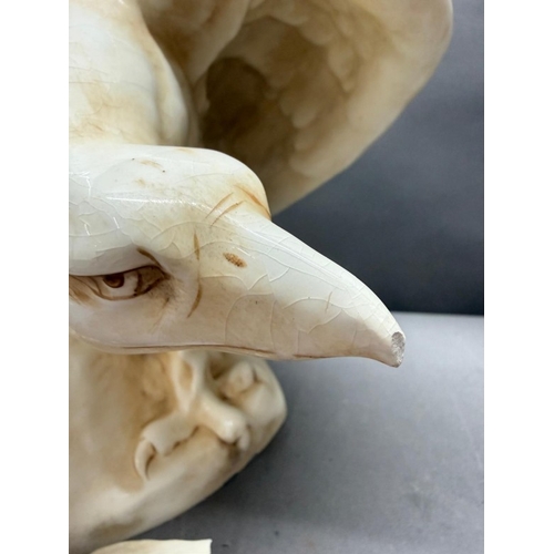 259 - A large Royal Dux eagle, circa 1920 with some damage wing tip present but in need of repair. Height ... 