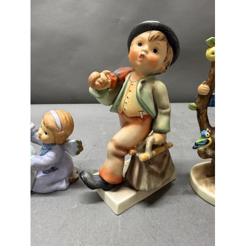261 - A selection of four Hummel figures various years and themes.