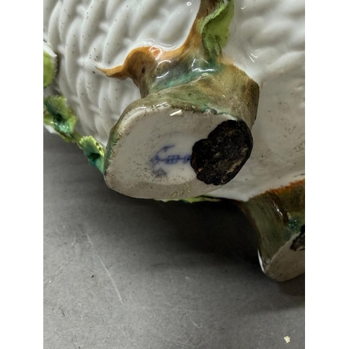 263 - A white basket weave style vase with floral decorative