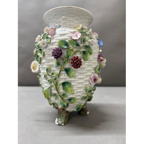 263 - A white basket weave style vase with floral decorative