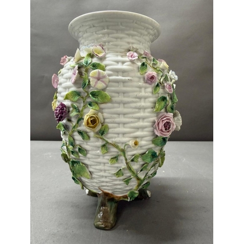 263 - A white basket weave style vase with floral decorative